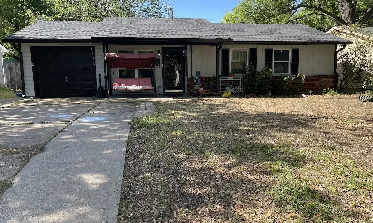 Asphalt Shingle Roof Repair crew at work on a residential roof in Auburn